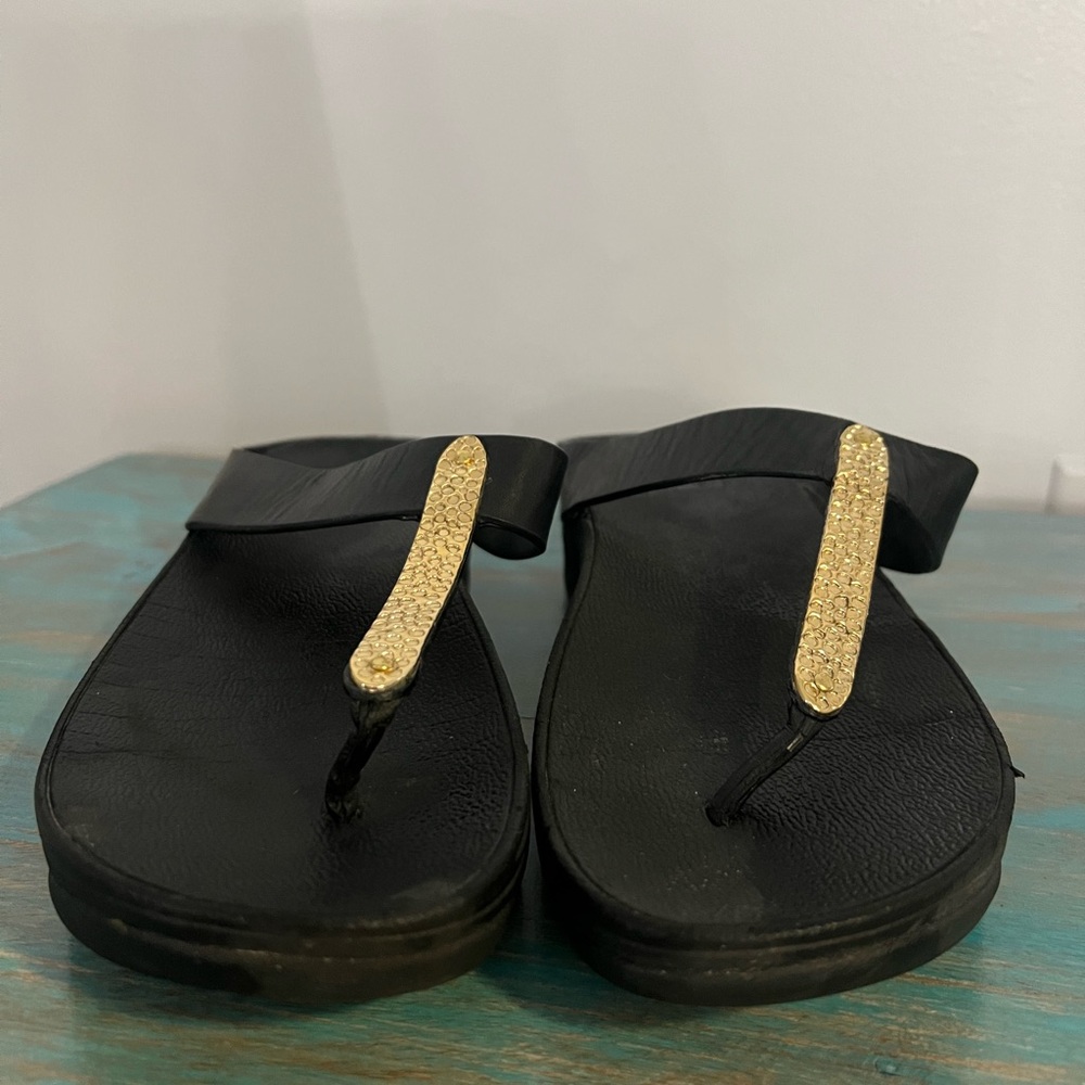 FitFlop black sandal with gold accent